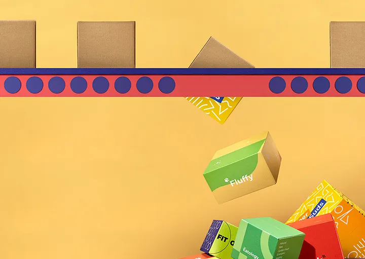 Custom shipping boxes on a conveyor with printed boxes tumbling below it